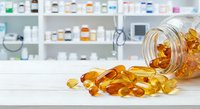 Omega-3 fish oil capsules spilling from glass jar on pharmacy counter with medicine bottles on shelves in background for health and wellness supplements.