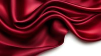 Luxurious red silk fabric with elegant flowing waves and smooth texture creating dramatic folds and curves on white background for premium design projects.