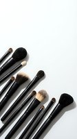 Professional makeup brushes set arranged on white background for beauty and cosmetics applications with copy space for text.