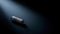 Message in bottle floating on dark water surface with dramatic lighting and mysterious atmosphere for storytelling concepts.
