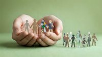 Hands protecting paper cut family figures representing care, support and social responsibility concepts for community welfare and insurance services.
