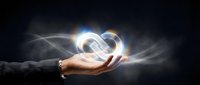 Businesswoman holding glowing infinity symbol with light rays, representing endless possibilities, innovation, and sustainable growth for corporate branding.