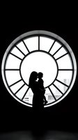 Mother and child silhouette embracing in front of large circular window with geometric frame creating dramatic black and white contrast for family concepts.