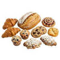 Assorted fresh baked goods including croissants, artisan bread, muffins, cookies and pastries isolated on white background for bakery, cafe and food design projects.