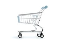 Empty shopping cart on white background, side view. Metal wire basket with wheels isolated for retail and commerce concepts.