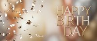 Elegant golden Happy Birthday text with shimmering confetti on a soft beige bokeh background, perfect for luxury celebration greeting cards and banners.