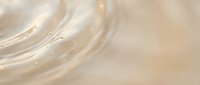 Elegant cream and gold abstract background with flowing silk-like waves and soft luminous highlights creating luxurious texture for premium design projects.