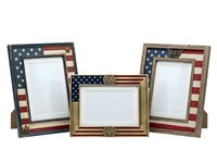 Patriotic wooden photo frames with American flag design, isolated on white background. Set of three decorative frames featuring stars and stripes pattern, ready for design use on merchandise, home decor projects, and promotional materials.