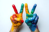 Colorful painted hands showing peace signs against white background, representing unity, creativity and diversity in artistic expression.