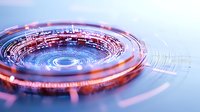 Futuristic circular technology pattern with glowing orange and blue light effects creating dynamic motion trails and digital rings on reflective surface.
