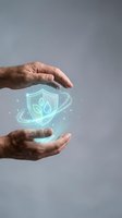 Male hands holding glowing shield with leaf icon, representing environmental protection, sustainability, and eco-friendly security for business and technology concepts.