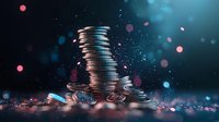 Stacked silver coins on dark background with glowing pink and blue bokeh lights creating magical financial atmosphere for business and investment concepts.
