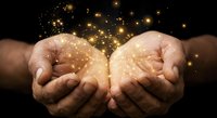 Cupped hands releasing magical golden sparkles and glowing particles against dark background, symbolizing hope, dreams, wishes and spiritual energy.