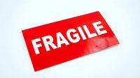Red fragile sticker label for shipping packages and delicate items transportation warning sign isolated on white background for design projects.