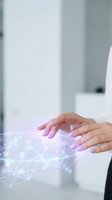 Female hands with manicured nails interacting with glowing digital network visualization on white surface, representing technology, data connection, and innovation for business applications.