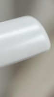 Roll of white bubble wrap with protective air-filled bubbles, ideal for packaging, shipping, and product protection in logistics and e-commerce applications.