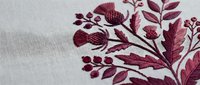 Burgundy floral embroidery on white linen fabric featuring leaves, berries and botanical motifs for textile design, crafts and home decor projects.