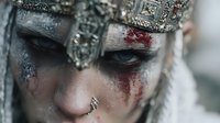 Fantasy warrior woman with ornate metal crown and dramatic face paint featuring silver and red makeup for cosplay and creative projects.