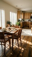 Bright kitchen and dining area with wooden furniture, white plantation shutters, potted plants, and natural sunlight streaming through windows for home decor and interior design inspiration.