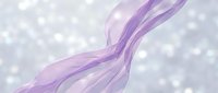 Flowing purple silk ribbons with soft bokeh light effects on blurred background, suitable for elegant designs, presentations, and creative projects.