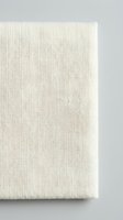 Natural linen canvas texture with woven fabric pattern on neutral background for artistic projects and craft applications.
