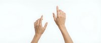 Two hands pointing upward with index fingers extended against clean white background for presentation and advertising concepts.