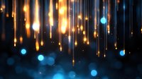 Abstract glowing golden light streaks and blue bokeh circles on dark background, creating magical atmospheric effect for festive designs.