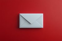 White paper envelope on vibrant red background with dramatic shadow, minimalist composition for business communication and correspondence concepts.