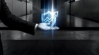 Young male professional in business suit holding glowing upward arrow shield symbol, representing growth, protection, and success in corporate environment for financial and business concepts.