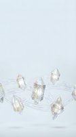 Floating crystal prisms connected by glowing energy lines create mystical geometric network on white background for spiritual and technology concepts.