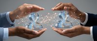Businessmen with hands cupping digital human figures connected by glowing network lines, representing AI, collaboration, and technology innovation for business solutions.