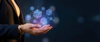 Businesswoman holding glowing geometric shapes and network connections, representing digital innovation, technology solutions, and data management for corporate presentations.