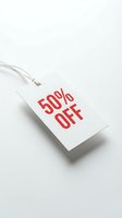 White retail price tag with bold red 50% off text on light background, conveying discount and sale promotion for retail and marketing use.