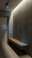 Modern smart home entrance with digital interface panels and ambient lighting showcasing futuristic interior design and home automation technology.