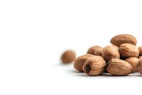 Whole brown pecans scattered on white background with copy space, isolated nuts composition for food packaging and healthy snack advertising.