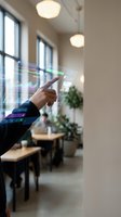 Hand touching holographic data visualization with colorful graphs and charts in modern office space with natural light, suitable for business technology and digital transformation concepts.