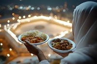Muslim woman in white hijab holding traditional plates with food during Ramadan evening, city lights bokeh background creates festive atmosphere.
