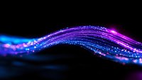 Glowing neon wave with sparkling particles flowing in dark space, vibrant blue and purple light trails creating dynamic motion effect on black background.