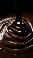 Melted chocolate dripping from spoon into swirling pool, creating rich brown waves and glossy texture. Perfect for food, dessert, and culinary design projects.
