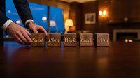Business professional arranging wooden blocks spelling Start Plan Work Check Win on office desk, representing strategic planning and success methodology.