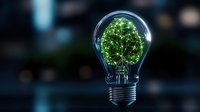 Glowing green tree inside light bulb on dark background symbolizing eco-friendly innovation, sustainable energy solutions and environmental conservation.