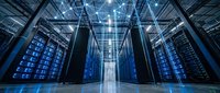 Modern data center with rows of server racks illuminated in blue light, featuring advanced computing infrastructure for cloud storage, networking, and enterprise technology solutions.