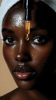 Close-up portrait of woman with glowing skin and serum drop falling from dropper onto forehead, showcasing skincare and beauty treatment results.