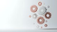 Metallic rose gold and white gears floating against light gray background, symbolizing teamwork, innovation, and mechanical engineering concepts.