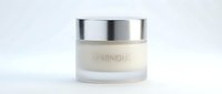 Luxury skincare jar with metallic silver lid containing creamy moisturizer or anti-aging treatment, isolated on white background for cosmetics, beauty product packaging design.