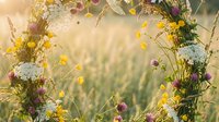 Natural wildflower wreath with yellow and purple blooms in golden sunlight meadow setting for rustic wedding decor and seasonal celebrations.