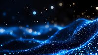 Glowing blue particles flow in waves against dark background creating magical atmosphere with bokeh light effects and sparkles. Suitable for tech backgrounds.