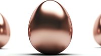 Shiny rose gold metallic eggs on white background for luxury Easter decoration and premium holiday design projects.