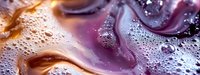 Abstract liquid art background with purple and gold swirls, bubbles and organic shapes creating mesmerizing fluid patterns. Macro photography of paint mixing.