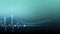 Medical heartbeat pulse wave on gradient teal background for healthcare technology presentations and cardiac monitoring displays.